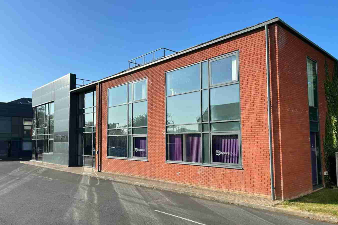 Exterior of Freyja Medical Shrewsbury clinic located inside Sterling House, a modern red-brick building with large windows.